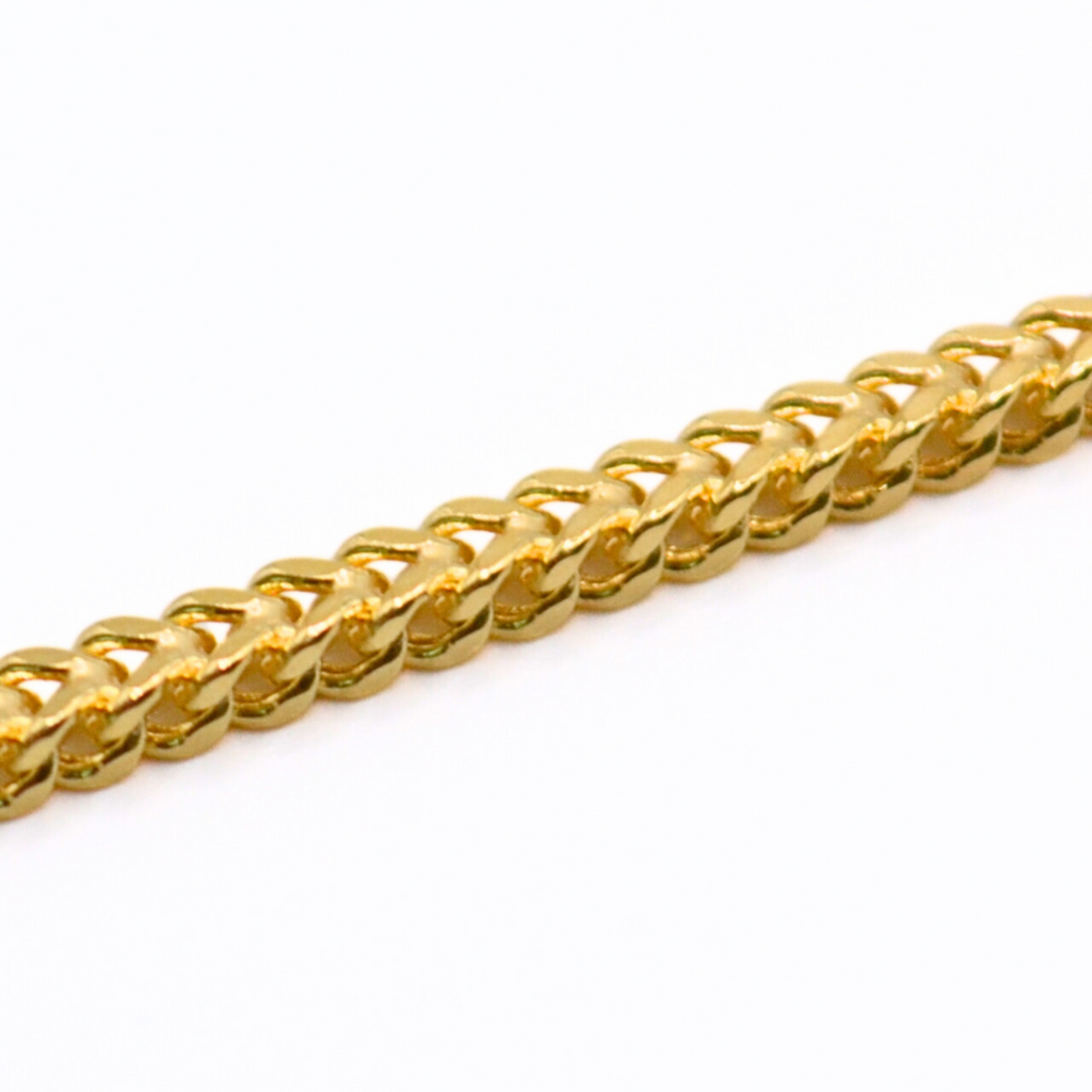 14K gold Franco chain bracelet on white background