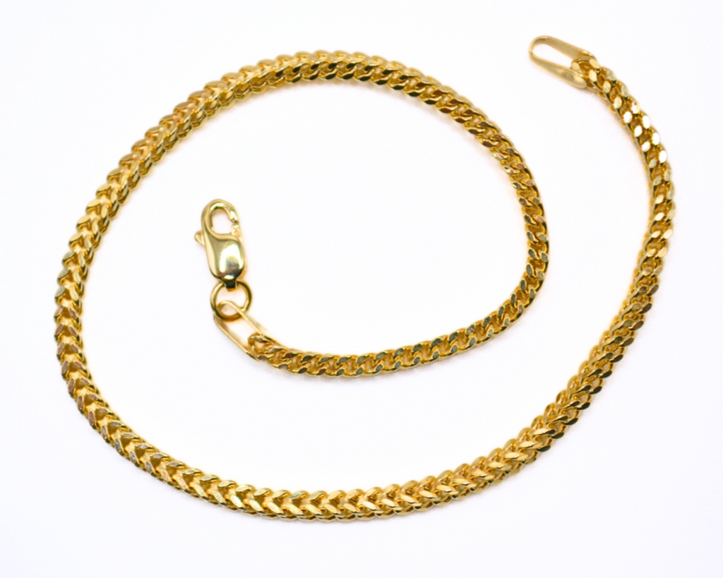 14K gold Franco chain bracelet on white background
