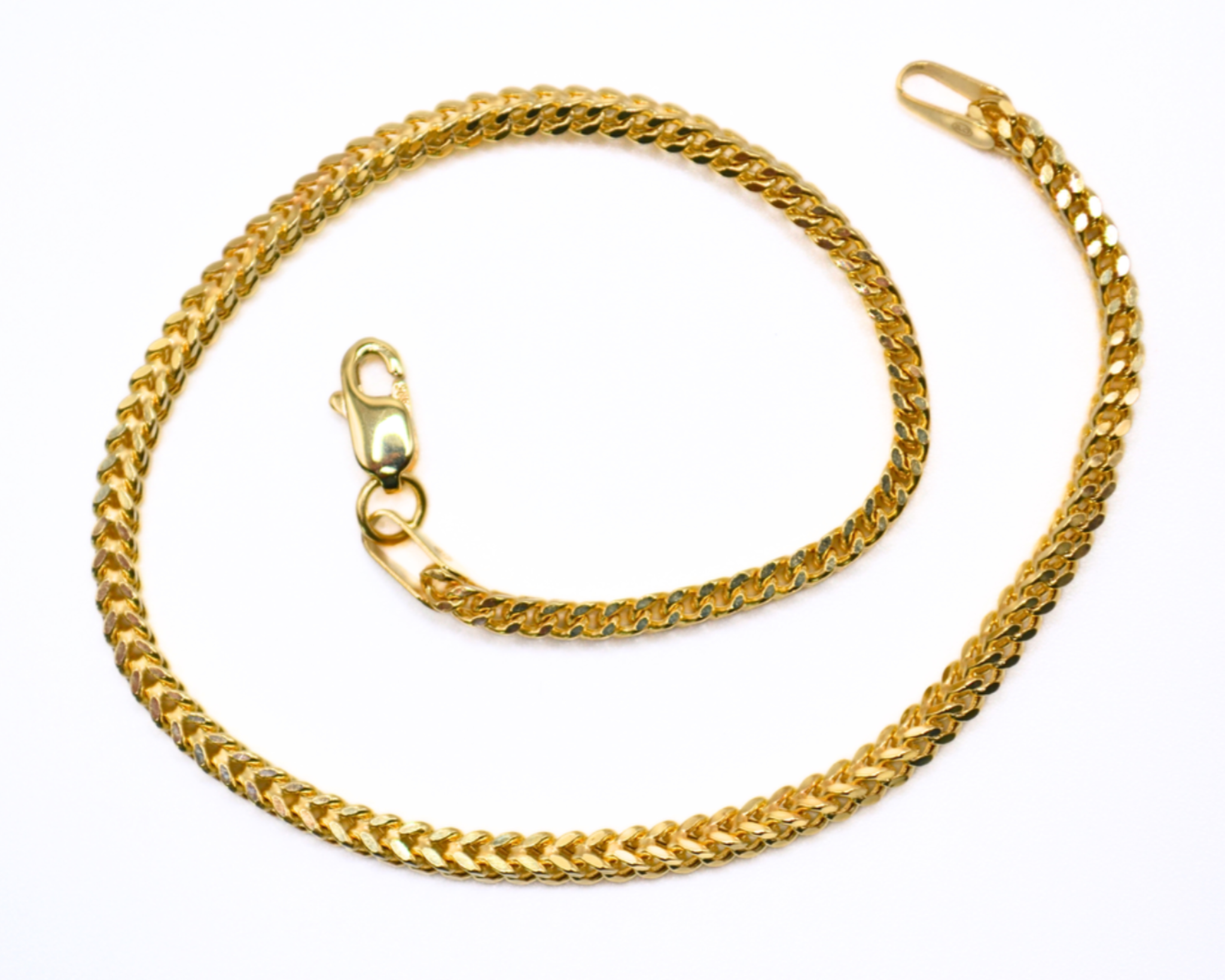 14K gold Franco chain bracelet on white background
